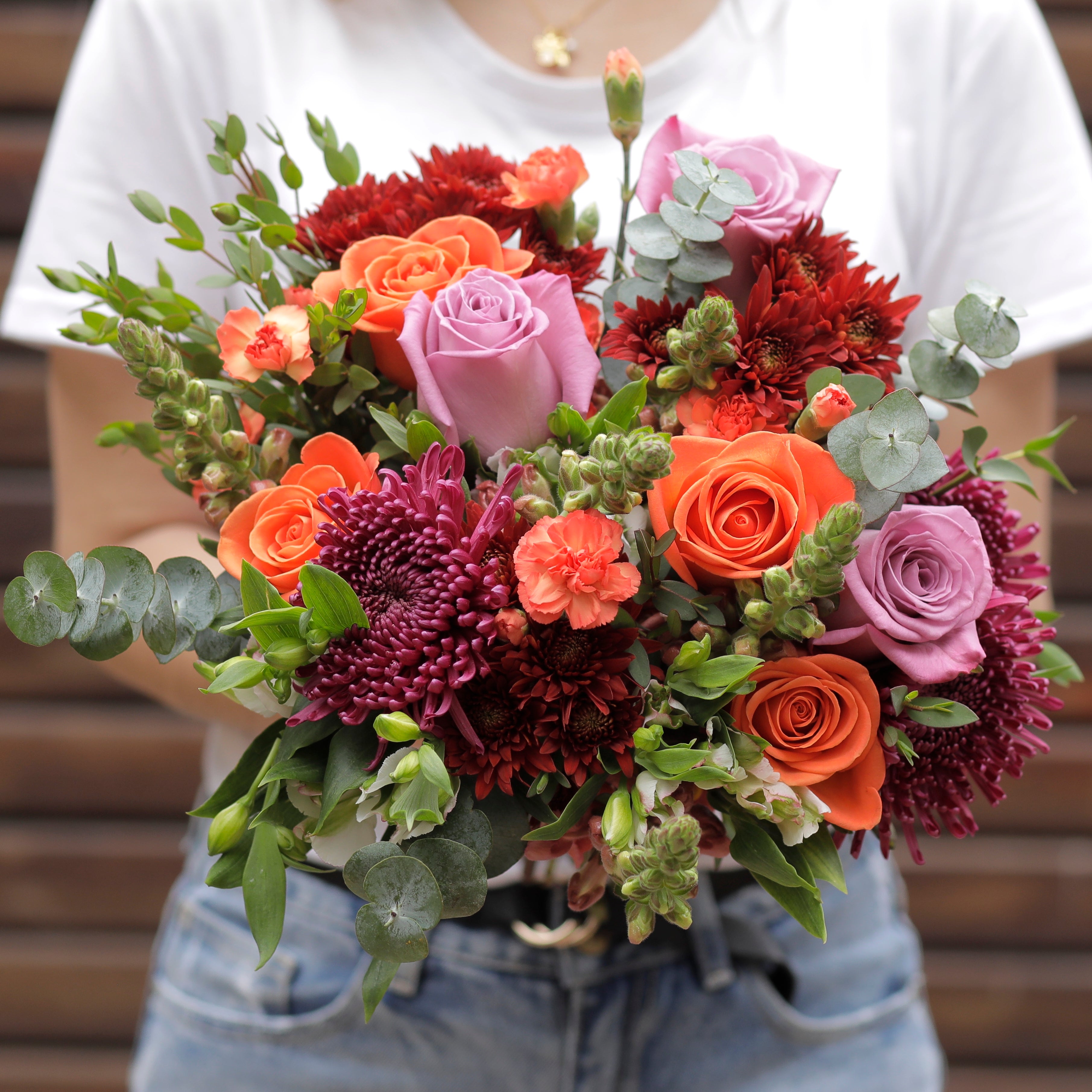 A Garden Collection bouquet features 30-35 stems of roses, snapdragons, chrysanthemum, and other farm-fresh varieties.