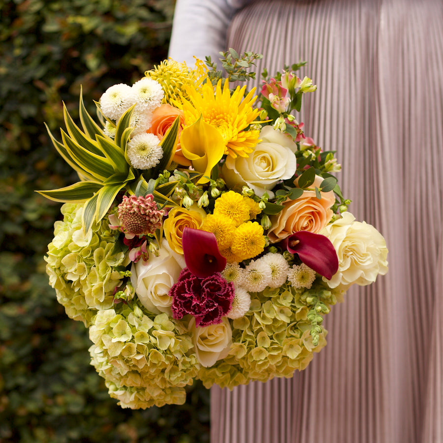 A Garden Collection bouquet features 30-35 stems of hydrangea, Callas, roses, and other farm-fresh varieties. 