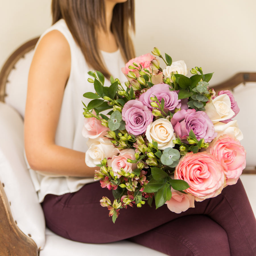 A Garden Collection bouquet features 30-35 stems of pink, purple, and white roses, alstroemeria, eucalyptus, and other farm-fresh varieties. 